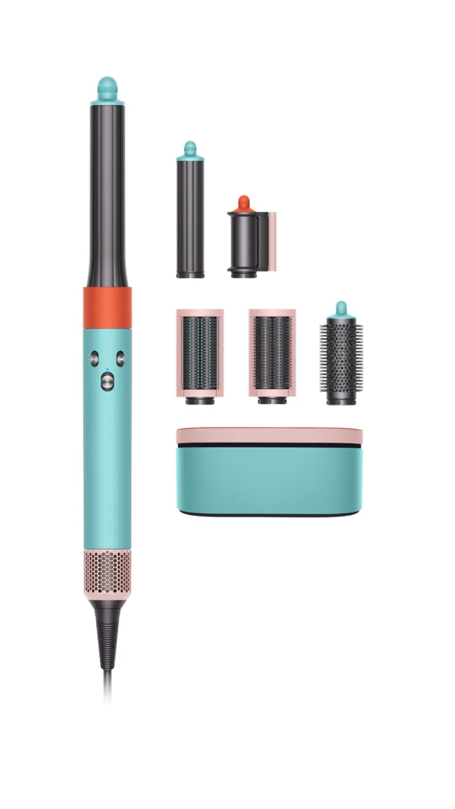 Turquoise and coral hair styler with multiple attachments and a matching storage box on a white background.