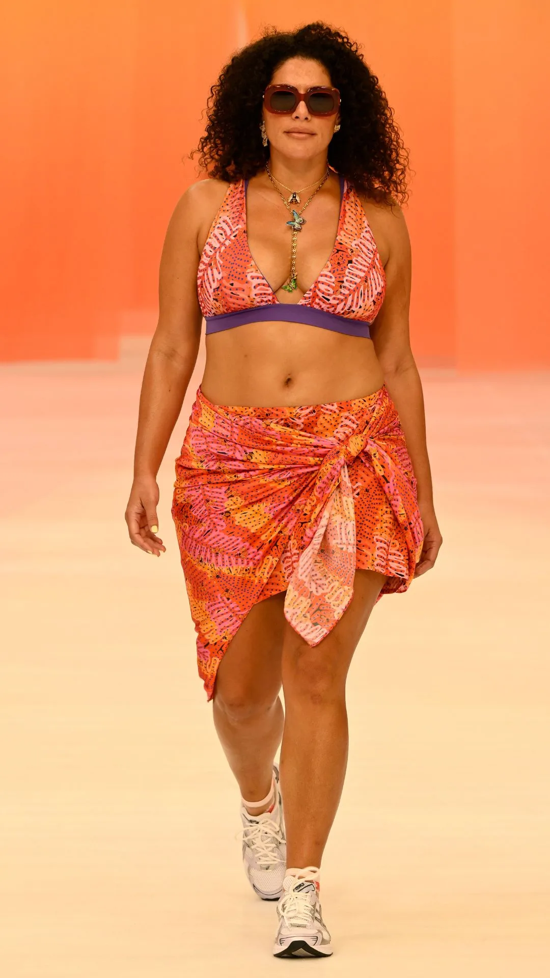 a model walks the runway for liandra swimwear at australian fashion week